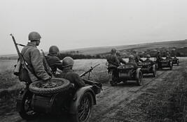 Troops on the move in three-man motorcycle sidecars (commanded by Battalion Commissar E. Khaimov)