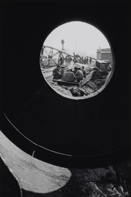 Seated Workers Viewed Through Porthole