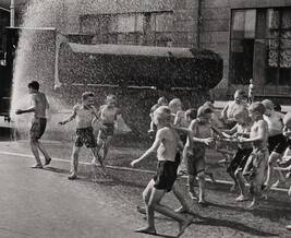 A Hot Summer's Day: Children at Play in the Spray of Moscow's First Sprinkler-Truck