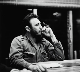 Fidel Castro Enjoys a Cigar