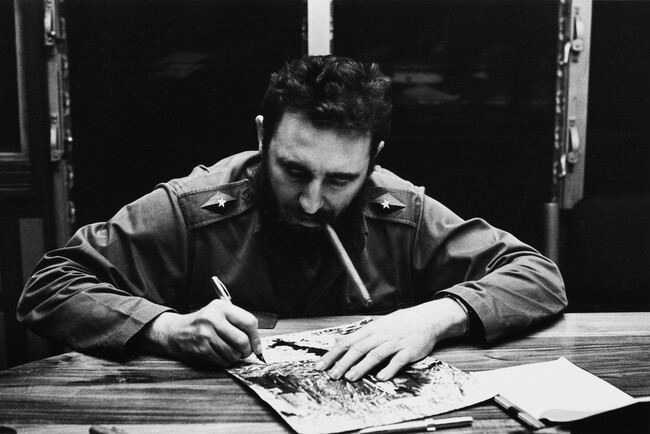 Fidel Castro Autographing a Portrait