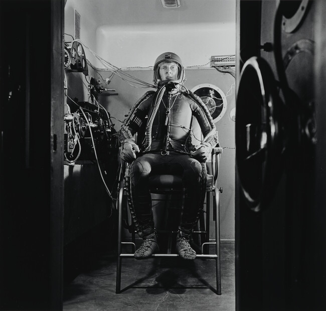 Cosmonaut Seated in the Simulator