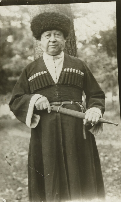 Bartlett dressed in a Chokha, holding a kindjal in the city of Ordzhonikidze