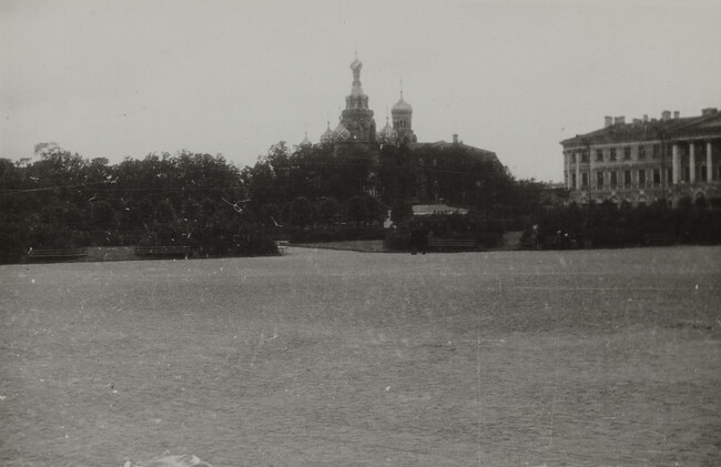 Scene of grassy park with onion domes in the distance, Leningrad
