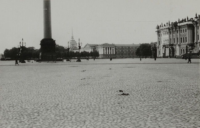 View of cobblestone plaza will palatial buildings and pedestrians in background, Leningrad