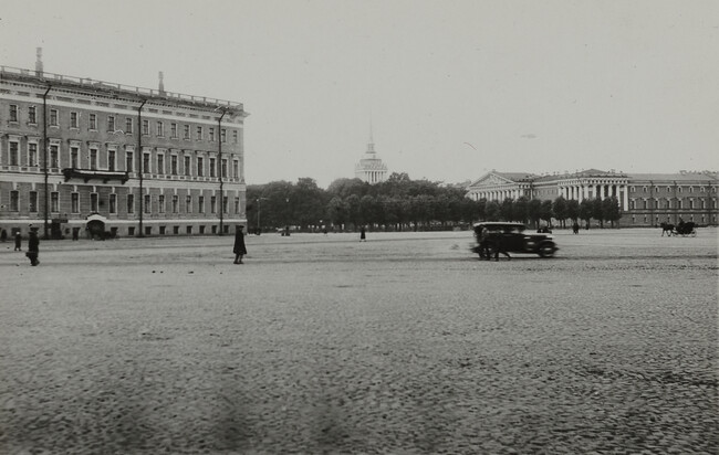 View of cobblestone plaza with car, pedestrians, and horse-drawn cart, Leningrad