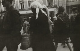 View of people walking, with woman in scarf in foreground, Moscow