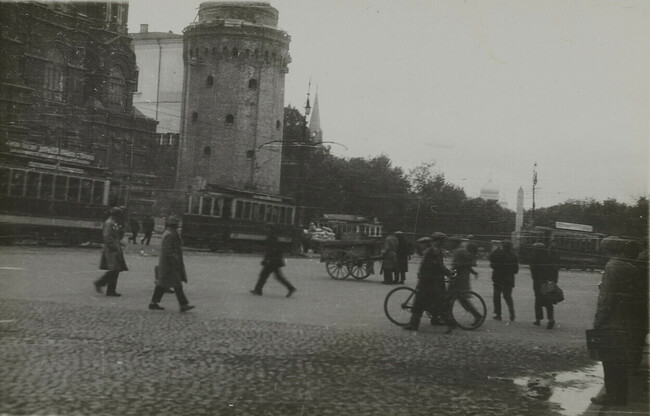 View of streetcar and pedestrians with handcart and bicycle, Moscow
