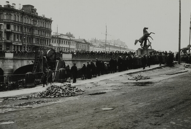 Crowds watching operation of dredging machines in canal at Anitchkov Bridge, Leningrad