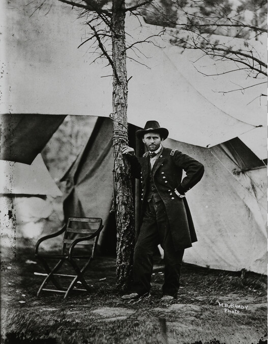 General Ulysses S. Grant (in camp, leaning against tree)