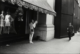 Woman Reading Paper, number 12, from the portfolio Garry Winogrand