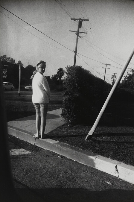 Girl in White Sweater, number 13, from the portfolio Garry Winogrand