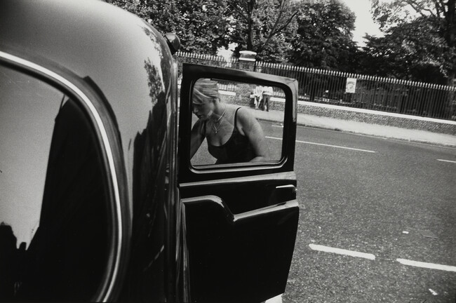 Woman Getting into Car, number 7, from the portfolio Garry Winogrand