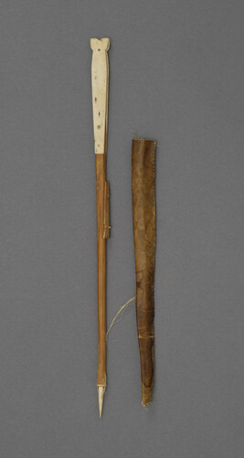 Model of harpoon and throwing board with leather sheath.