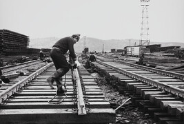 Railworker laying down track, Baikalo-Amurskaya Railroad, Tynda Town, Amur, Russia