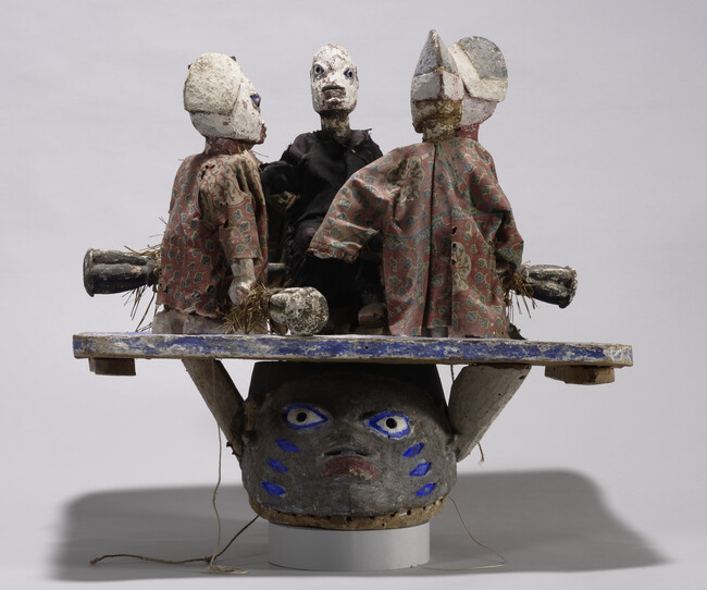 Gelede Mask Representing Osanyin, The Orisha of Herbal Medicines, Surrounded by Four Disciples
