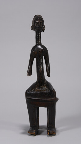 Female Figure Seated on Stool
