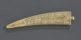 Decorated Cribbage Board, decorated on one side with a Dog Sled and a Totem Pole; on the other side with...