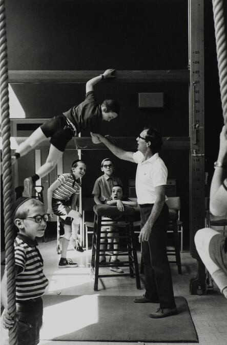 Alternate image #3 of Boy climbing in gymnasium, London, England