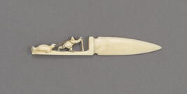 Ivory Letter Opener with a Carved Handle depicting a Hunter on a Sled Dragging a Seal