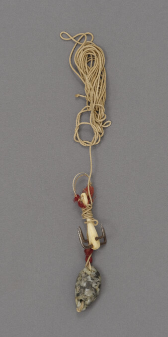 Hard twist cotton attached to a stone sinker and a four pronged hook with an ivory shank with red wool attached as a lure
