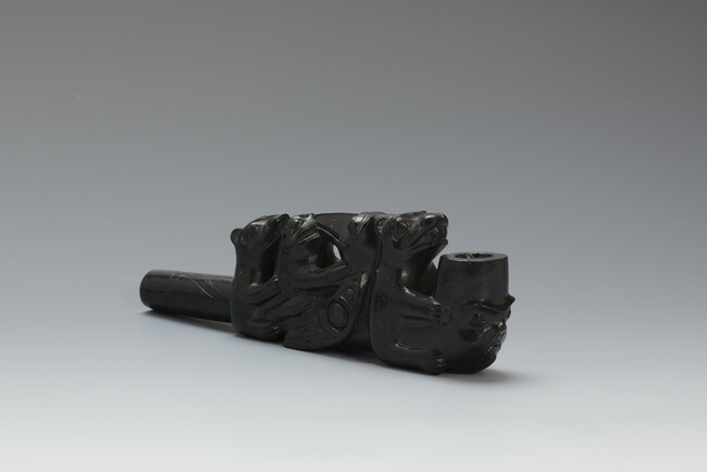 Alternate image #1 of Argillite Pipe depicting a Human Face with Goatee on the Bowl; a Bear holding the Bowl, a Raven and a Frog Facing each Other and another Bear