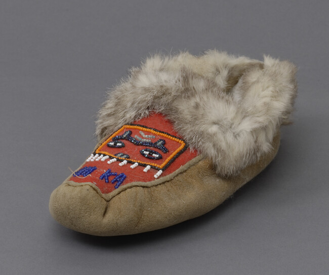 Moccasin with Beaded Representation of a Chilkat Robe and word ALASKA
