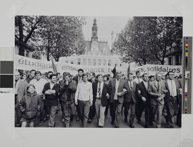Alternate image #1 of Student leaders Alain Geismar (arms crossed), Daniel Cohn-Bendit (hands in front of his face), and Jacques Sauvageot (in turtleneck) march together during student/worker demonstration, March 13, 1968