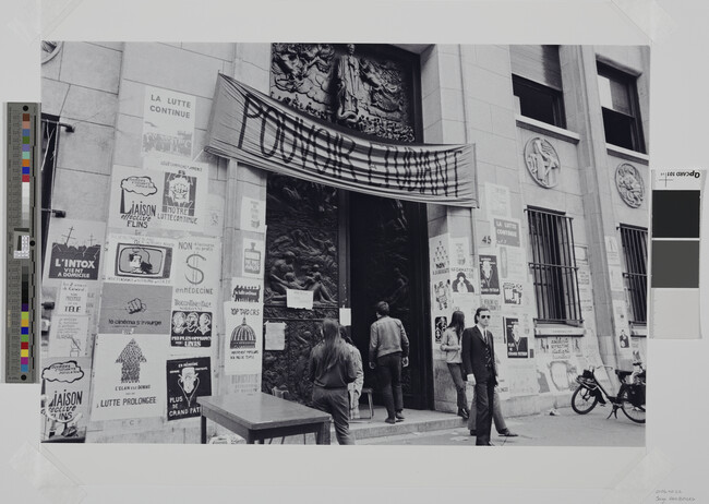 Alternate image #1 of Posters at the Faculté de Médecine with banner above door reading, 