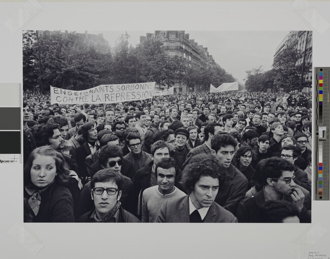 Alternate image #1 of Crowd of marching protestors with sign reading 