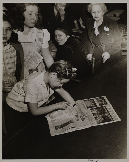 Alternate image #2 of Untitled (Girl looking at a newspaper)