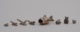 Miniature representations of fish, owl, bird, frog, fox?, and otters?