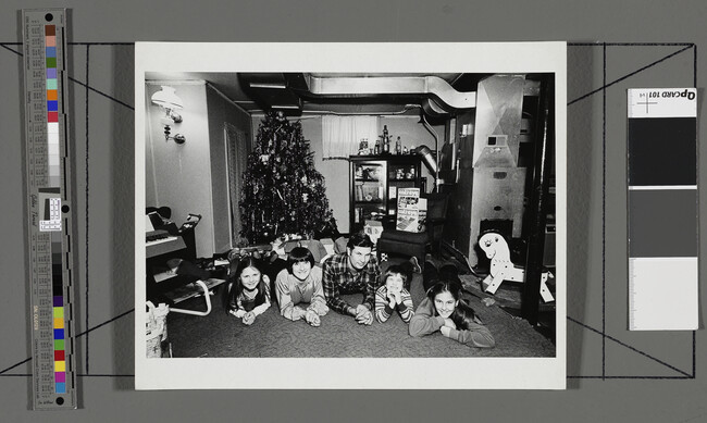 Alternate image #2 of Christmas, A Policeman, his Family and a Neighborhood Friend in the Basement Playroom of their House