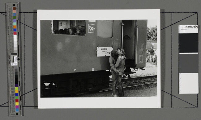 Alternate image #1 of Couple Kissing at a Train Station, Hungary