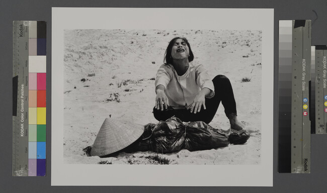 Alternate image #2 of A Woman Mourns Over the Body of her Husband After Identifying him by his Teeth, and Covering his Head with her Conical Hat.  The Man’s Body was Found with Forty-Seven Others in a Mass Grave Near Hue, April 11, 1969