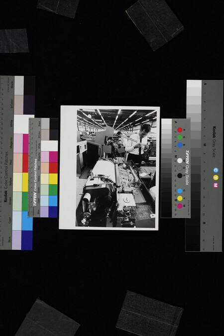 Alternate image #1 of Man inspecting part of machine in IBM factory, Mainz, West Germany