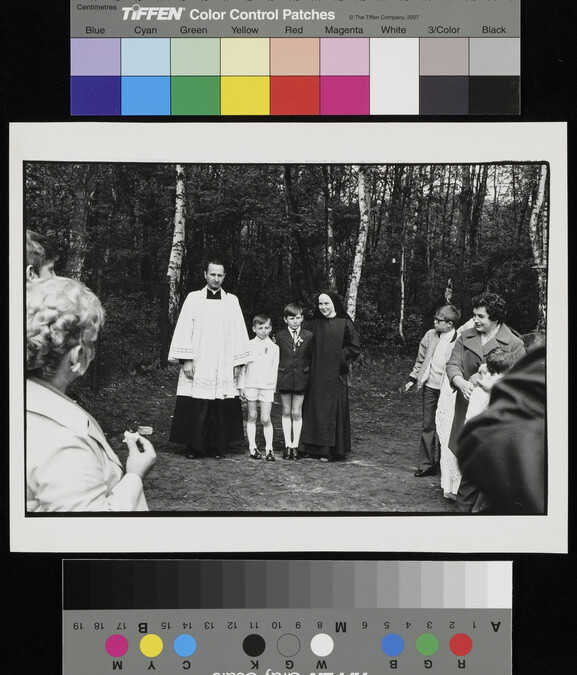 Alternate image #1 of Priest and nun stand with boys, village outside Warsaw, Poland