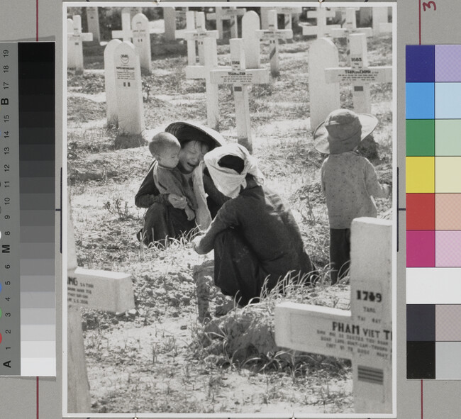 Alternate image #1 of Women and children at graveside. Nam Dinh, Vietname, May 21, 1954