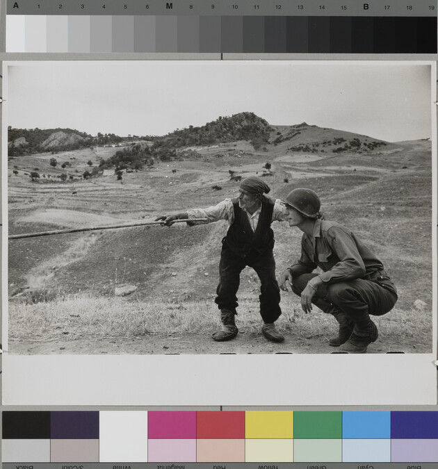 Alternate image #1 of Sicilian peasant telling an American officer which way the Germans had gone.  Near Troina, Italy, August, 1943