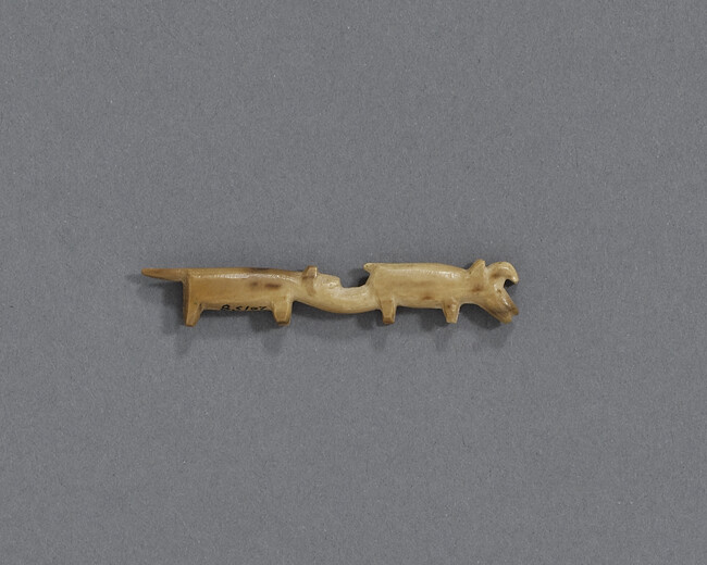 Miniature Carving of Wolf Facing a Horned Animal