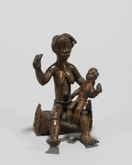 Mother and Child Seated on a Carved Log