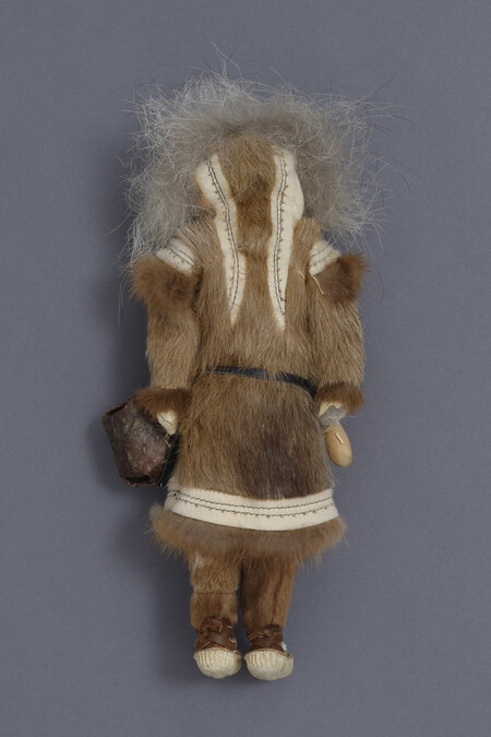 Alternate image #1 of Doll representing an Iñupiaq Woman Carrying a Child on her Back, Holding an Ulu and Dish