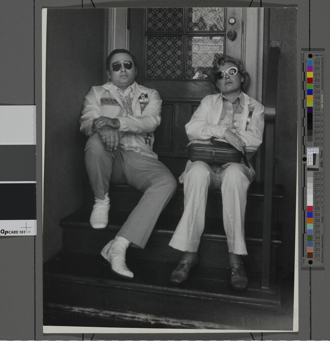 Alternate image #1 of Couple sitting in Stairwell Wearing Sunglasses