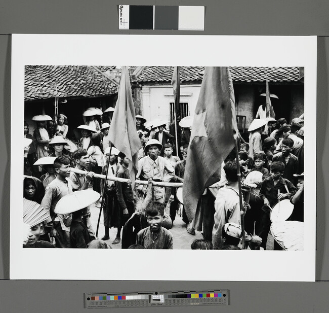 Alternate image #2 of Crowd with suckling pig on a stick, Vietnam