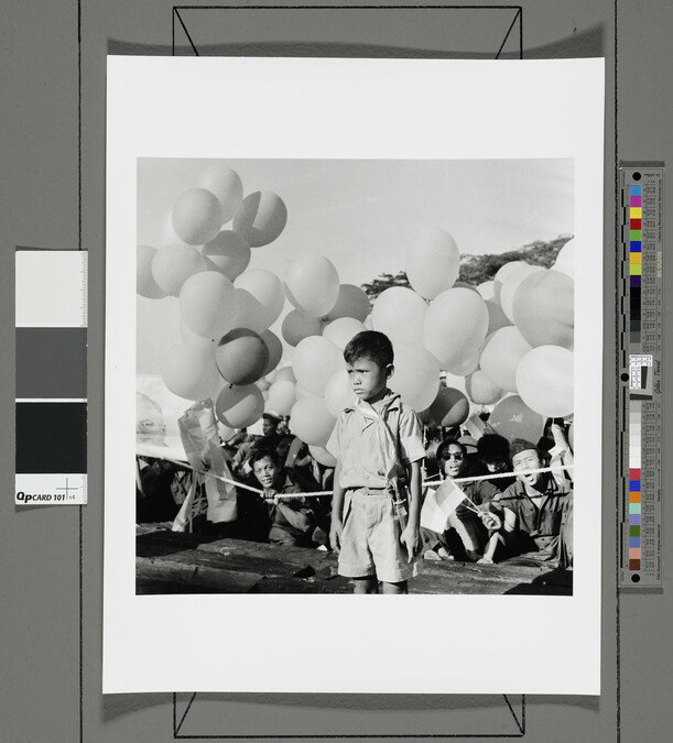 Alternate image #1 of Boy with balloons at political rally, Indonesia