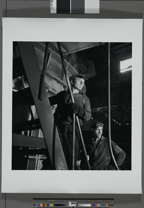 Alternate image #1 of Two factory workers posed on a staircase