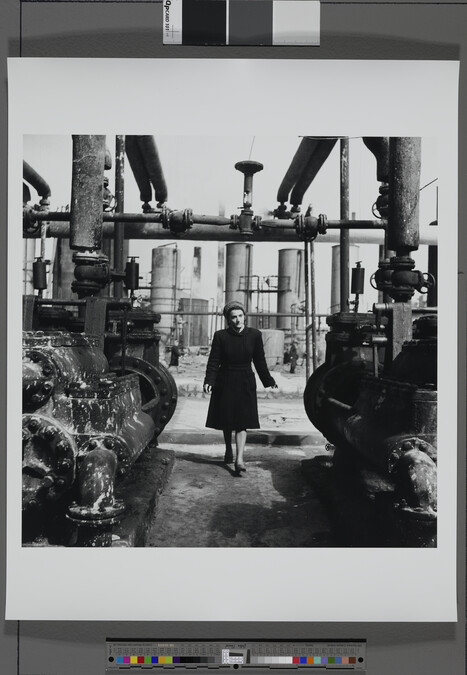 Alternate image #1 of Fashionable Woman Walking in a Factory