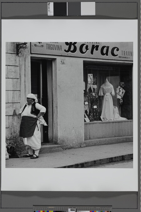 Alternate image #1 of Woman Outside Dress Shop, Yugoslavia