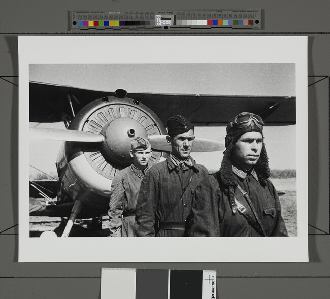 Alternate image #1 of Three airmen posed in front of their aircraft