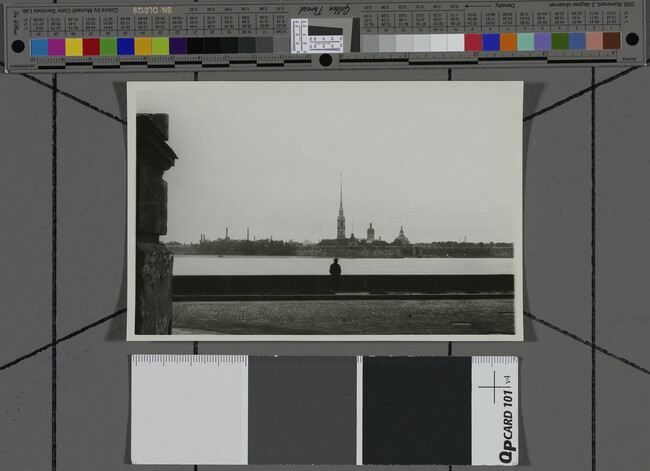 Alternate image #1 of View of river with man in foreground and spire in background, Leningrad